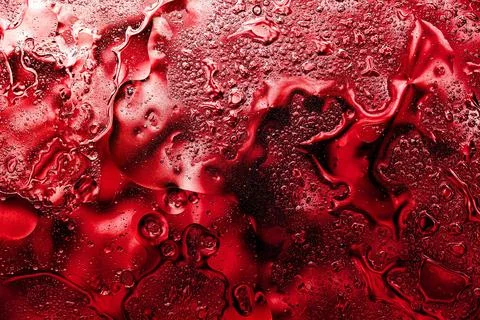 Ruby red boiling liquid abstract background photo Stock Photos