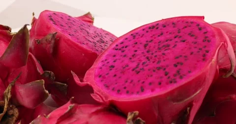 Ruby red exotic cactus dragon fruit whole cut half on white background Stock Footage 270142484