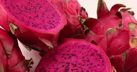 Ruby red exotic cactus dragon fruit whole cut half on white background Stock Footage 270142560