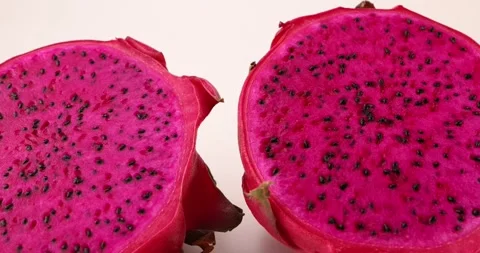 Ruby red exotic cactus dragon fruit whole cut half on white background Stock Footage 270142678