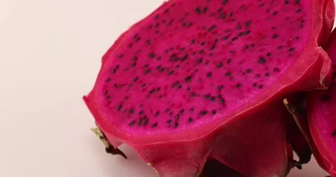 Ruby red exotic cactus dragon fruit whole cut half on white background Stock Footage 270142730