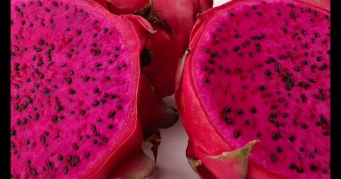 Ruby red exotic cactus dragon fruit whole cut half on white background Stock Footage 270142740