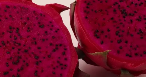 Ruby red exotic cactus dragon fruit whole cut half on white background Stock Footage 270142750