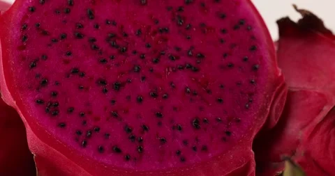 Ruby red exotic cactus dragon fruit whole cut half on white background Stock Footage 270143206