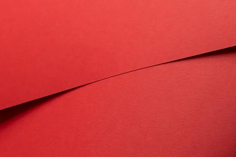 Ruby red paper background with a matte texture and soft tones. Bold crimson a Stock Photos
