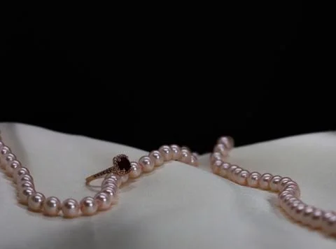 Ruby ring with pink pearl necklace Stock Photos