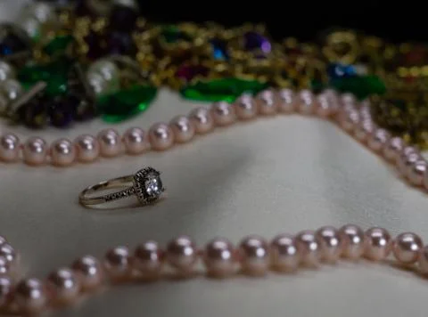 Ruby ring with pink pearl necklace and assorted jewelery Stock Photos