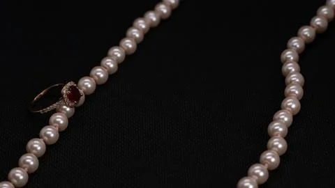 Ruby ring with pink pearl necklace 스톡 사진