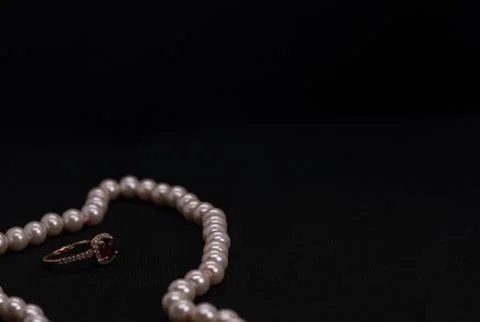 Ruby ring with pink pearl necklace Stock Photos