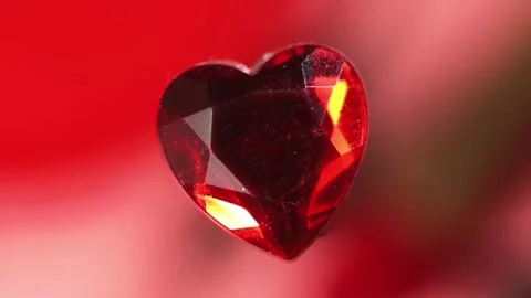 Ruby in the shape of a heart Video stock 165408395