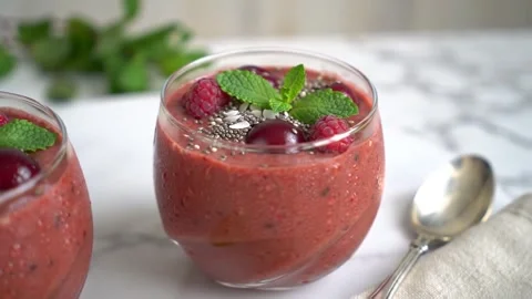 Ruby Sip  Healthy Red Smoothie Dessert with Berries  Mint Stock Footage 307432335