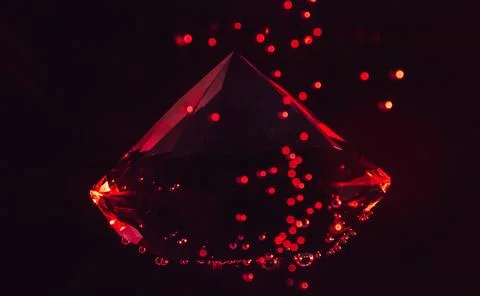 Ruby stone in water. Stock Photos