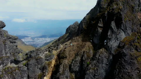 Rucu Pichincha, moving between the top to reveal Quito Stock Footage 234961520