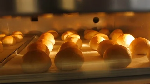 Ruddy Bread Rolls in the Oven Stock Footage 98149595
