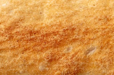 Ruddy crust of bread as an abstract background. Texture Stock Photos