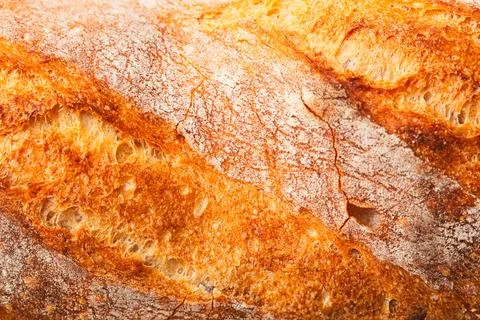 Ruddy crust of bread as an abstract background. Texture Stock Photos