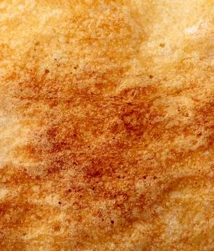 Ruddy crust of bread as an abstract background. Texture Stock Photos