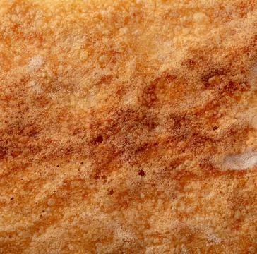 Ruddy crust of bread as an abstract background. Texture 스톡 사진
