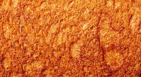 Ruddy crust of bread as an abstract background. Texture 스톡 사진