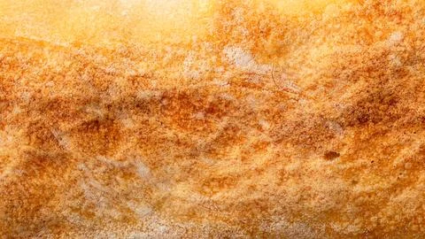 Ruddy crust of bread as an abstract background. Texture 스톡 사진