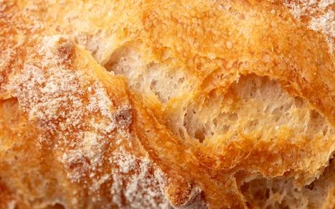 Ruddy crust of bread as an abstract background. Texture Foto stock