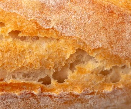 Ruddy crust of bread as an abstract background. Texture 스톡 사진