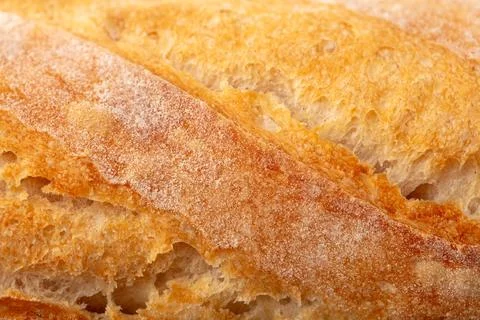 Ruddy crust of bread as an abstract background. Texture Stock Photos