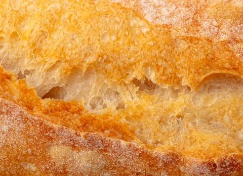 Ruddy crust of bread as an abstract background. Texture Stock Photos
