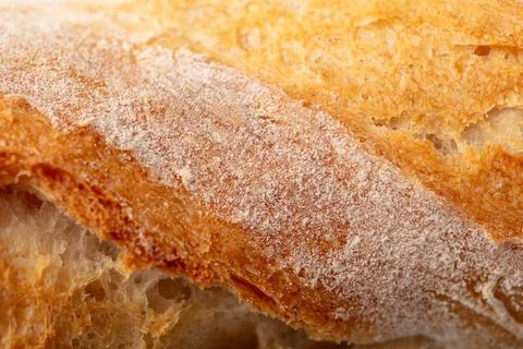 Ruddy crust of bread as an abstract background. Texture Foto stock