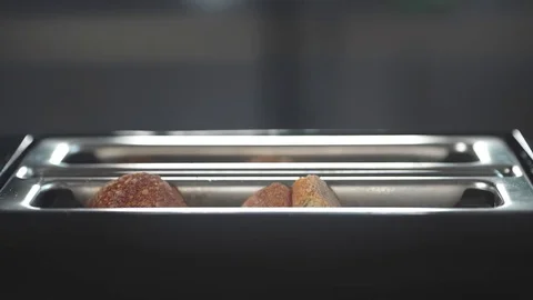 Ruddy toasts jumping out of the toaster, food for breakfast, english breakfast Stock Footage 75707623