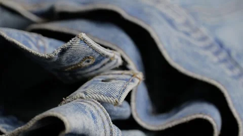 Ruffled denim jeans fabric texture close-up Video stock 340926717