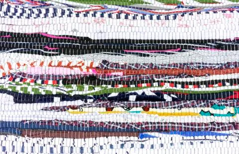 Rug of pieces of cloth. Texture and background of patchwork carpet. Stock-Fotos