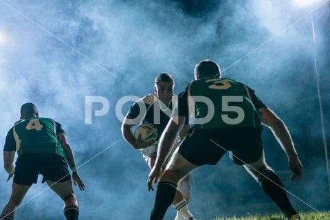 Rugby action under lights Stock Photos