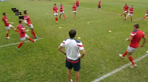 Rugby players run Stock Footage 30106329