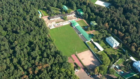 Rugby's pitch inside the park. Small stadium in circle view from above, Stock Footage 140817110