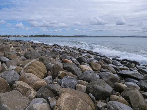 Rugged beach with boulders Stock Photos