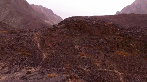 Rugged brown mountain formations with sharp cliffs Video stock 316332415