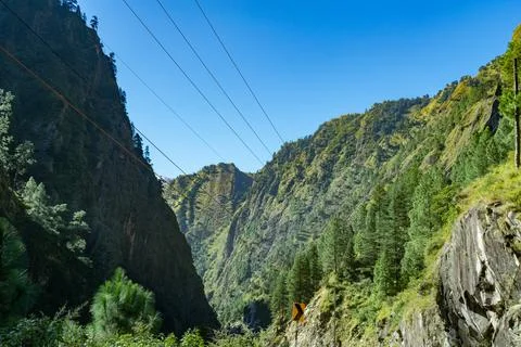 The Rugged Cliffs and Power Lines of the Alaknanda Valley in the Mana region Fotos Stock