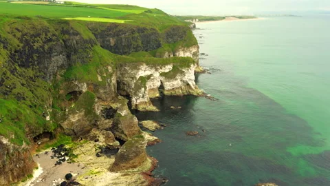 Rugged cliffs near the Giant's Causeway Northern Ireland Stock Footage 338332402
