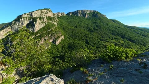 Rugged cliffs rise under clear blue skies. Sicevo Gorge, Serbia. Stock Footage 337052077