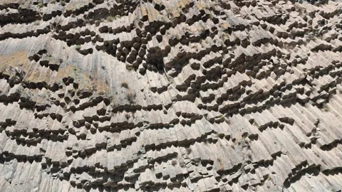 Rugged cliffside displaying columnar jointed volcanic rock Stock Footage 341777025