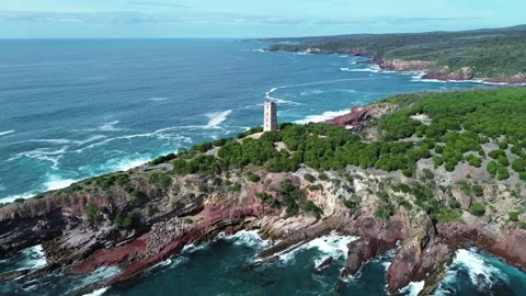 Rugged Cliffside Headland and Boyd Tower Stock Footage 334902154