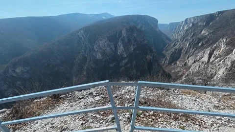 Rugged cliffside overlooks vast, steep canyon. Balkan, Eastern Europe, POV Vídeos de archivo 331450481