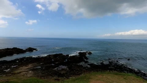 Rugged Coastal Ocean Views: Waves Crashing Against Rocks Stock Footage 296100289