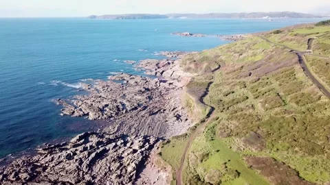 Rugged Coastal Path and Cliffs — Slow Aerial Coastline Drift Stock Footage 325855631