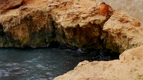 Rugged Coastal Rocks Shaped by Waves and Erosion 스톡 동영상 345006905