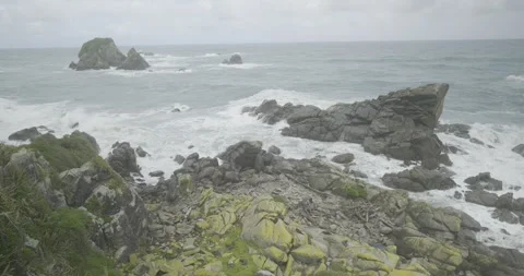 Rugged Coastline Beach, Waves crash on Rocks, 4K Stock Footage 240453949