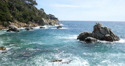 Rugged Coastline of Costa Brava – Pristine Mediterranean Waters 動画素材 299293207