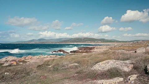 Rugged coastline scenery with ocean waves crashing Video stock 320304590