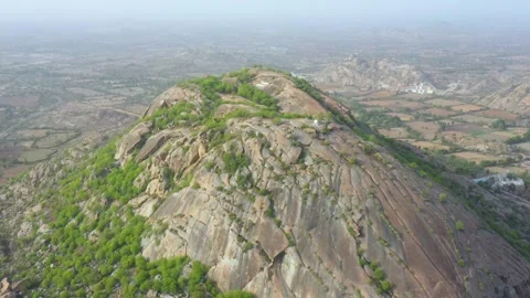 Rugged Hillscape with Distant Farmlands Stock Footage 314056325